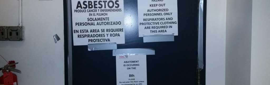 Asbestos signs on a door