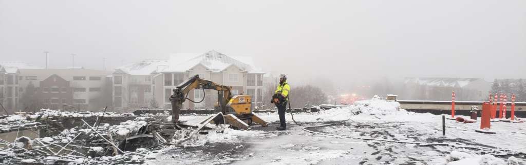 Worker with a pile of rubble